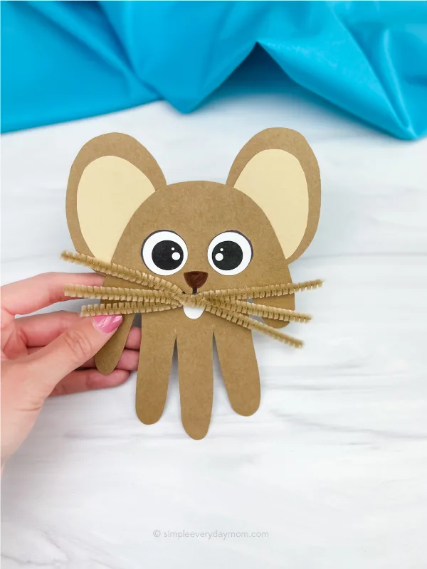 hand holding handprint mouse craft