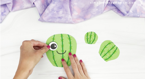 hand gluing eye to Mother's Day cactus craft