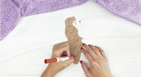 hand drawing fluff marks onto llama mothers day card craft