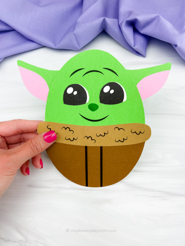 hand holding Baby Yoda Easter egg craft