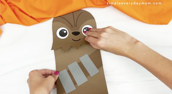 hand gluing body to Chewbacca paper bag craft