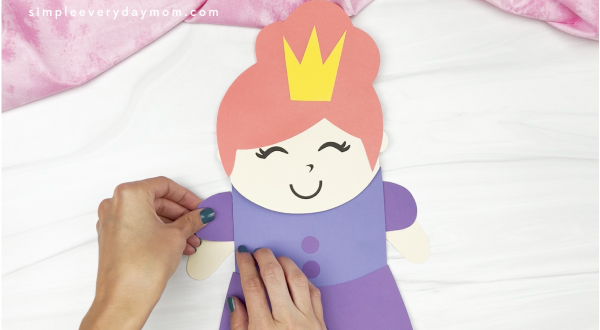 hand gluing sleeve to princess puppet craft
