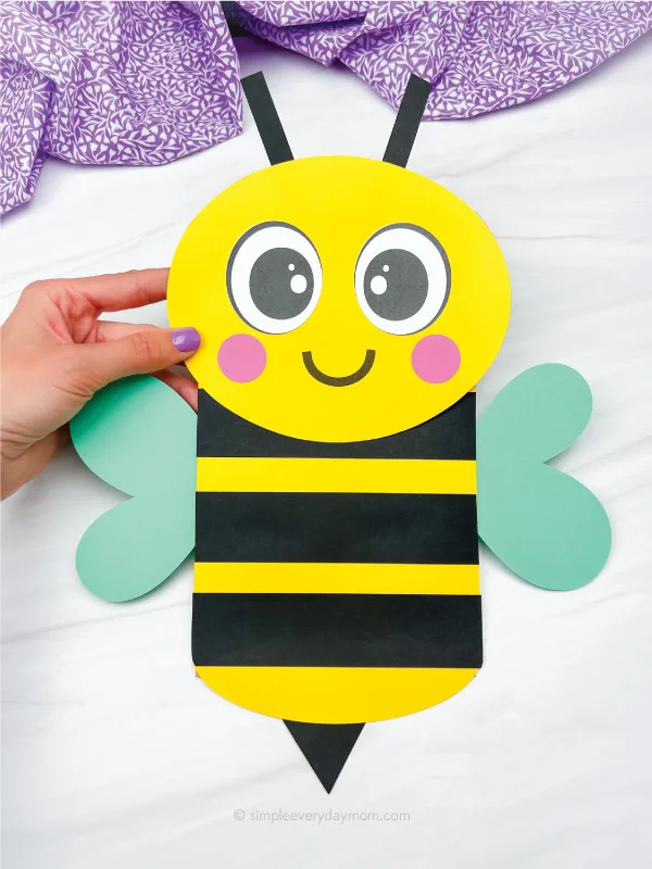 hand holding paper bag bee craft