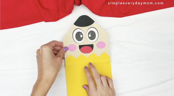 hand gluing top to pencil puppet craft