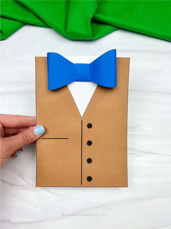 hand holding Father's Day bowtie card craft