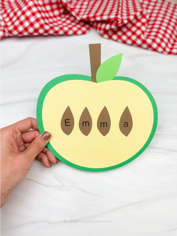 hand holding apple name craft