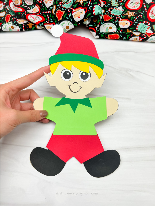 hand holding elf gingerbread in disguise craft