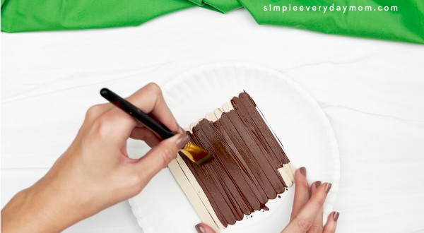 hand painting popsicle sticks brown