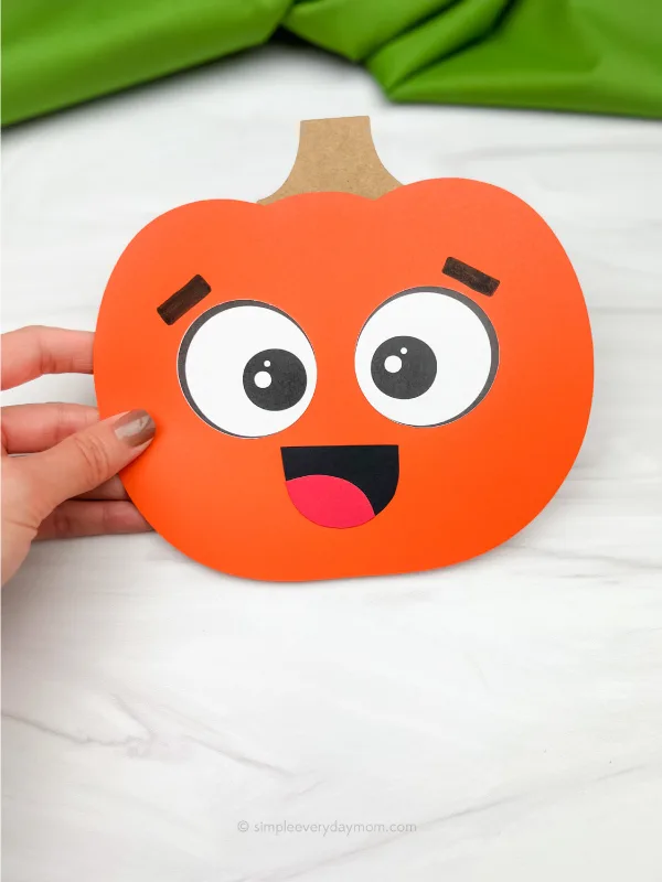 hand holding pumpkin emotion craft