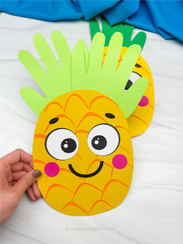 handprint pineapple craft with another one in the background