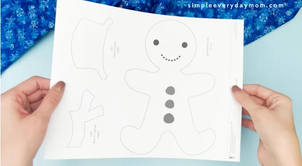 hand holding gingerbread man snowman disguise craft template