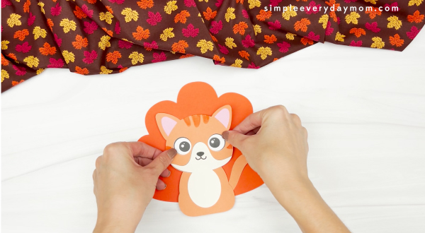 hand gluing body to turkey in disguise cat craft