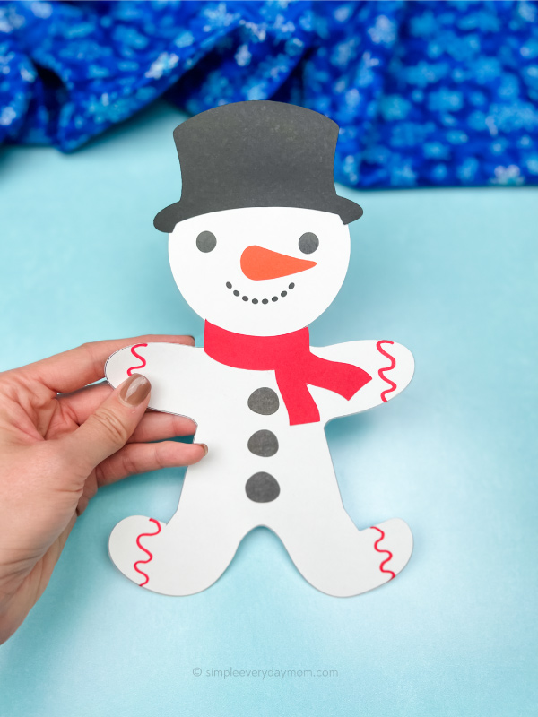 hand holding snowman gingerbread man disguise craft