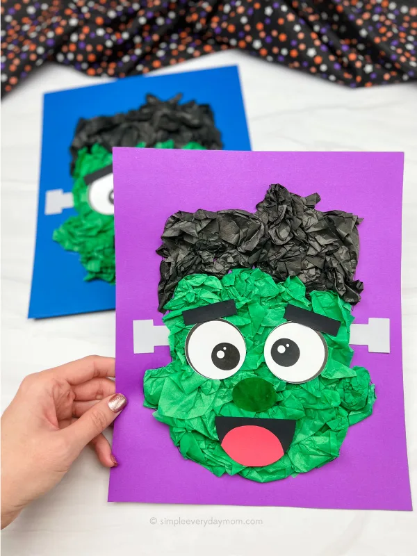 hand holding Frankenstein tissue paper craft with another craft in the background