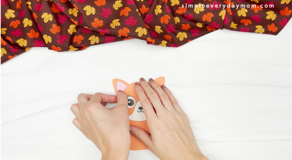 hand gluing inner ear to turkey in disguise cat craft