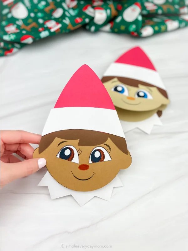 elf on the shelf being held in hand to display 