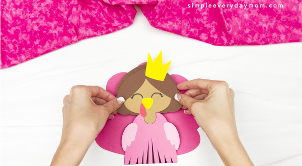 hand gluing feathers to princess turkey disguise craft