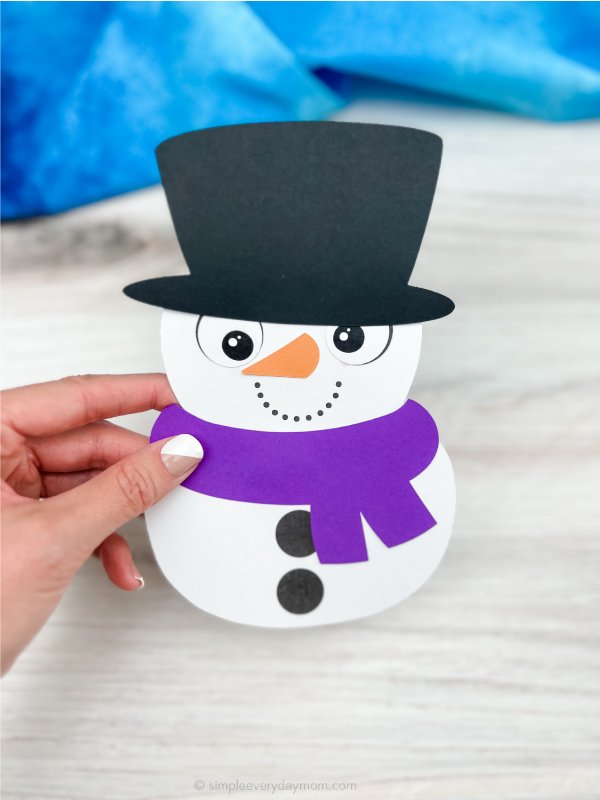 hand holding snowman card craft