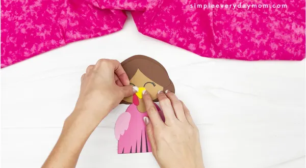 hand gluing beak to princess turkey disguise craft