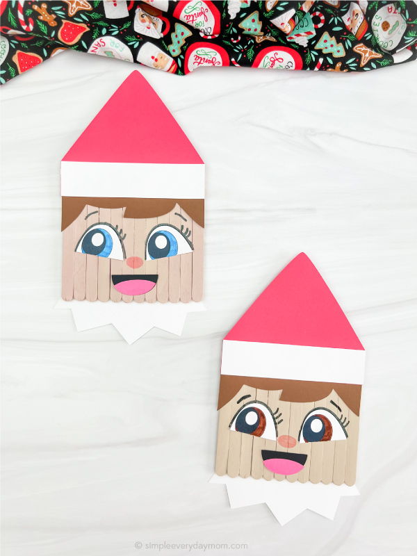 two finished elf on the shelf popsicle stick craft side by side