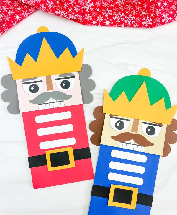 two finished nutcracker paper bag craft side by side