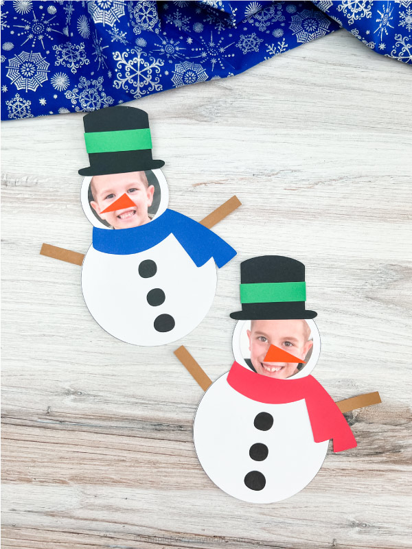 two finished snowman photo craft side by side