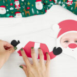 hands glueing mittens onto Santa photo craft