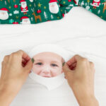 hands placing beard cutout onto face for Santa photo craft