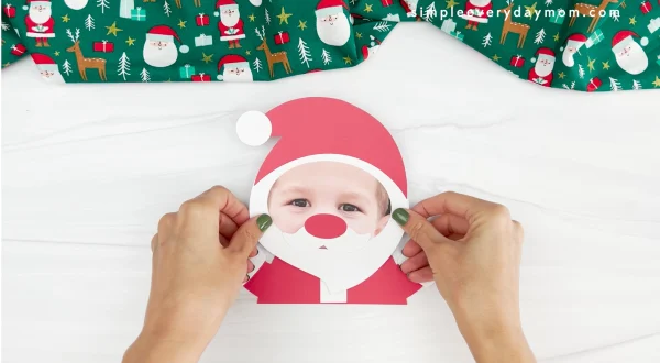 hands placing beard on face of Santa photo craft