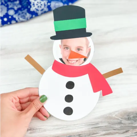 hand holding finished snowman photo craft