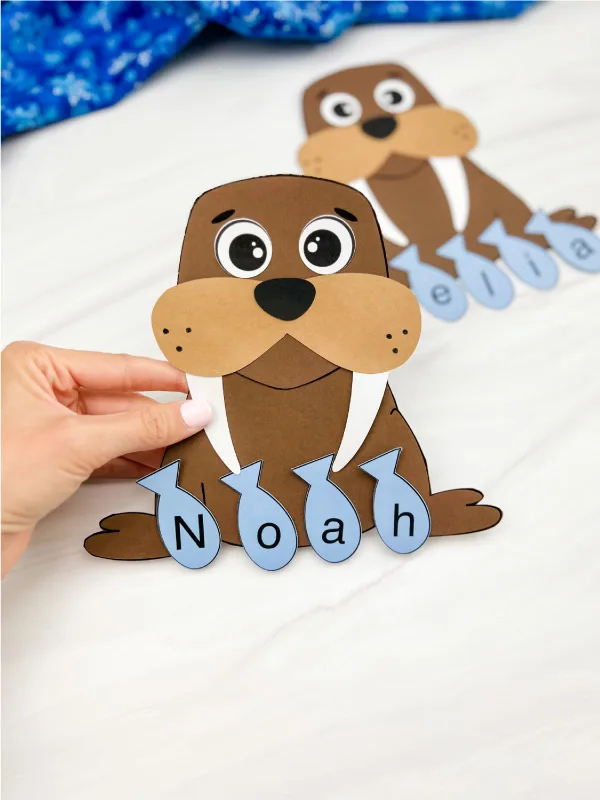 hand holding finished example of walrus name craft