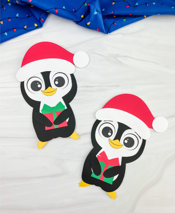 two finished Christmas penguin craft side by side