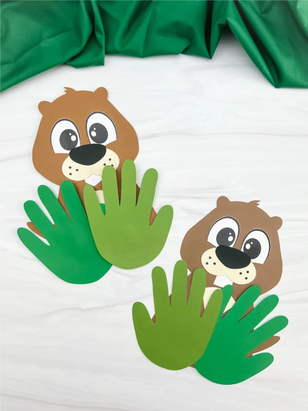 two finished examples of groundhog handprint craft