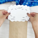 hands gluing head to owl babies puppet craft