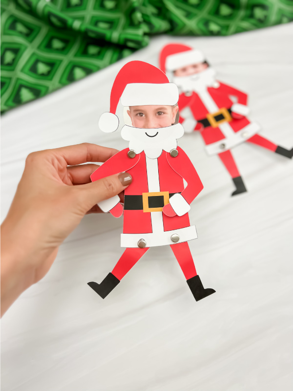 hand holding finished Santa photo craft with another one in background