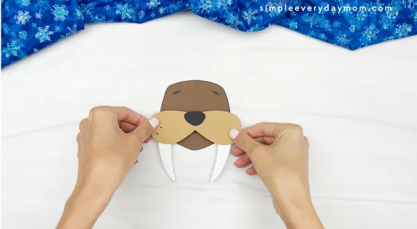 hands assembling face for walrus name craft