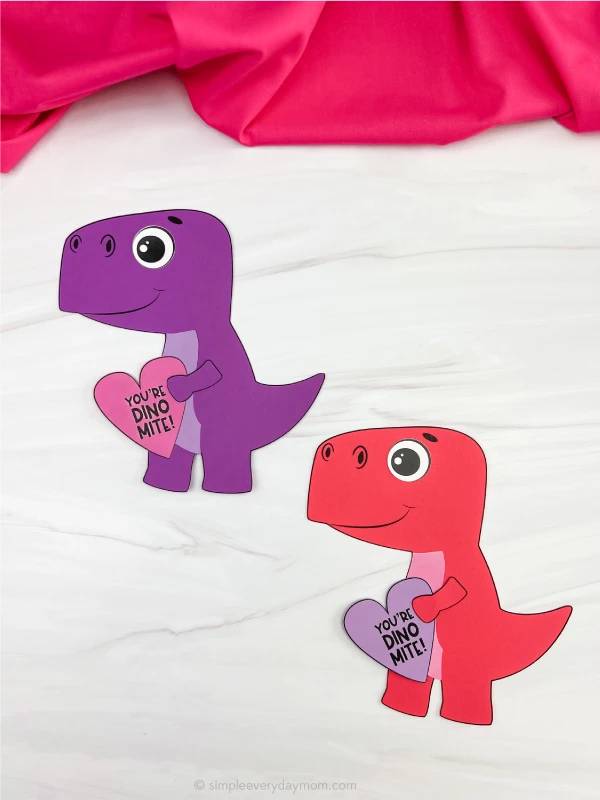 two examples of finished dinosaur valentine craft