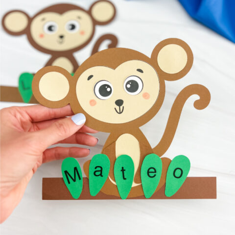 hand holding finished monkey name craft