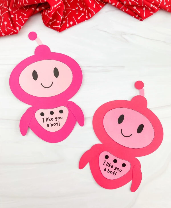 two examples of finished valentine robot craft side by side