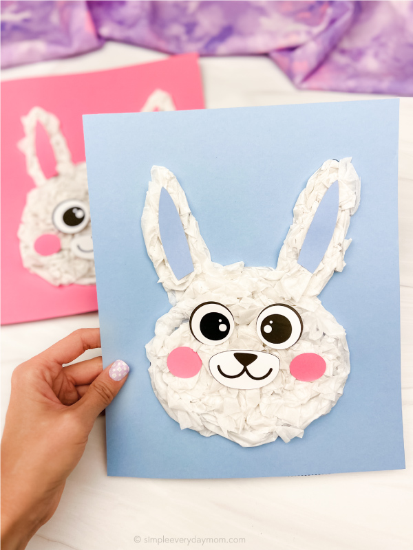 hand holding tissue paper bunny craft with another in background