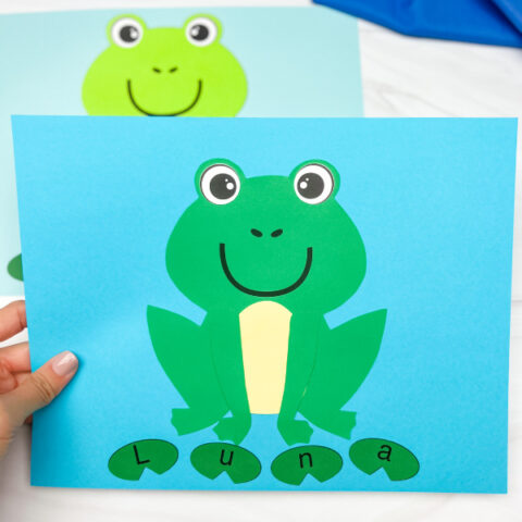 hand holding finished frog name craft with another one in background