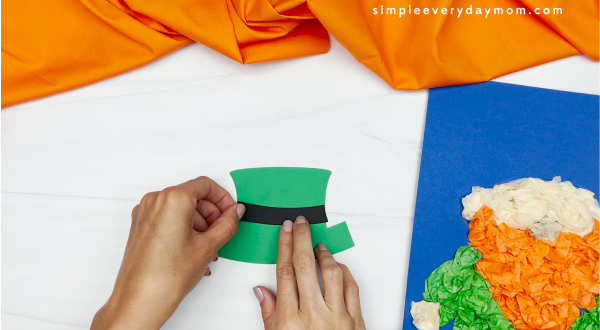 hands assembling hat for leprechaun