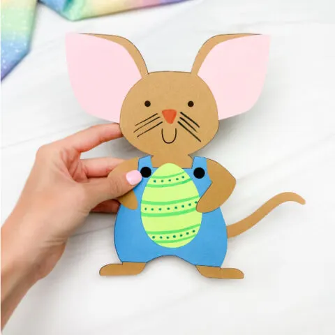 hand holding single image of happy easter mouse