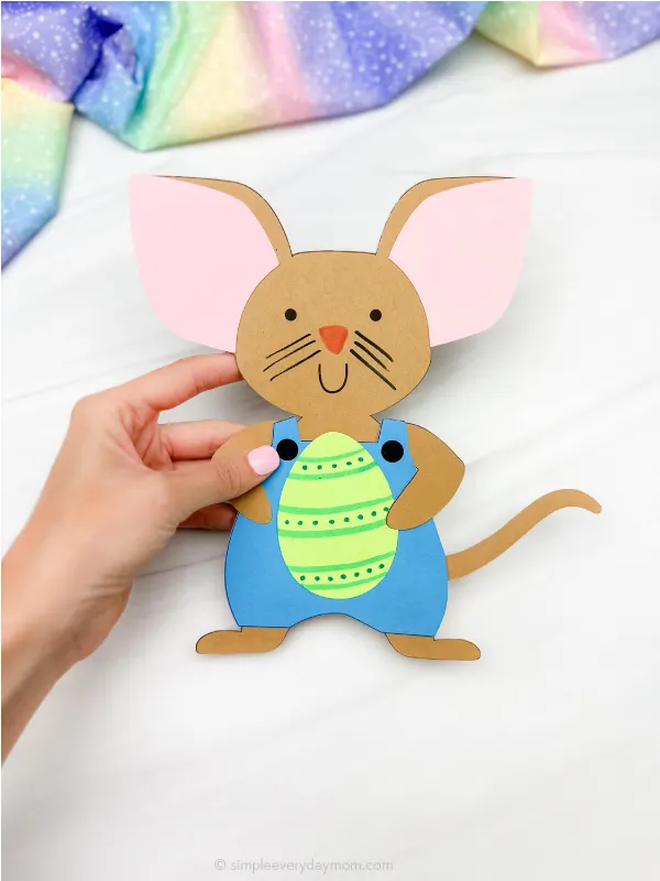 hand holding single image of happy easter mouse