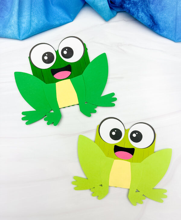 two examples of finished popsicle stick frog craft side by side