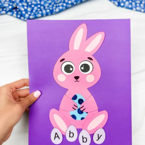 hand holding finished example of bunny name craft