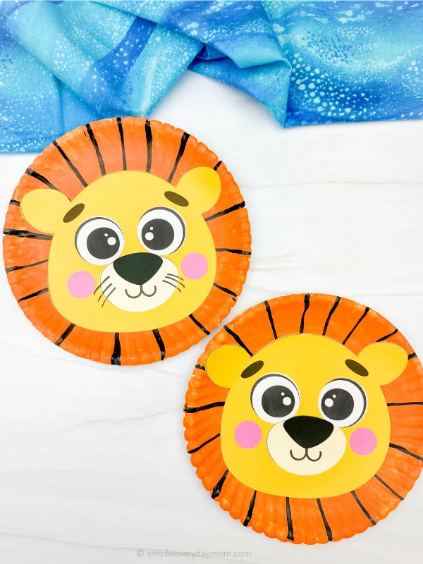 two examples of finished lion paper plate craft