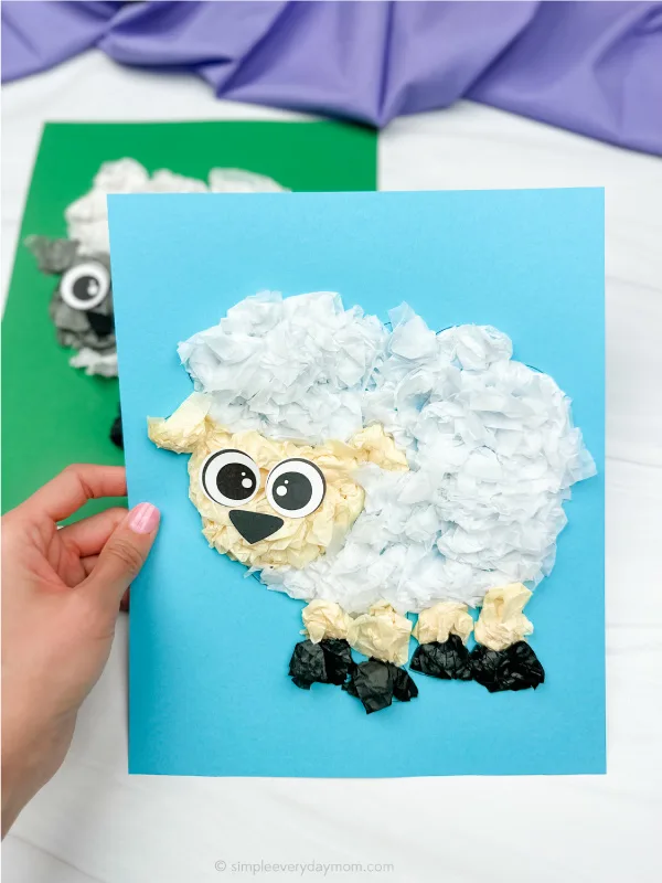 hand holding sheep tissue paper craft with another example in background
