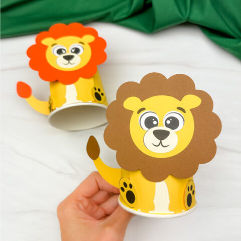 hand holding lion paper cup craft with another example in background