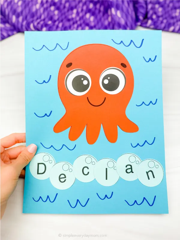 hand holding finished example of octopus name craft